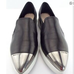 Miu Miu Black Authentic Leather Slip-Ons with Silver Toe Caps